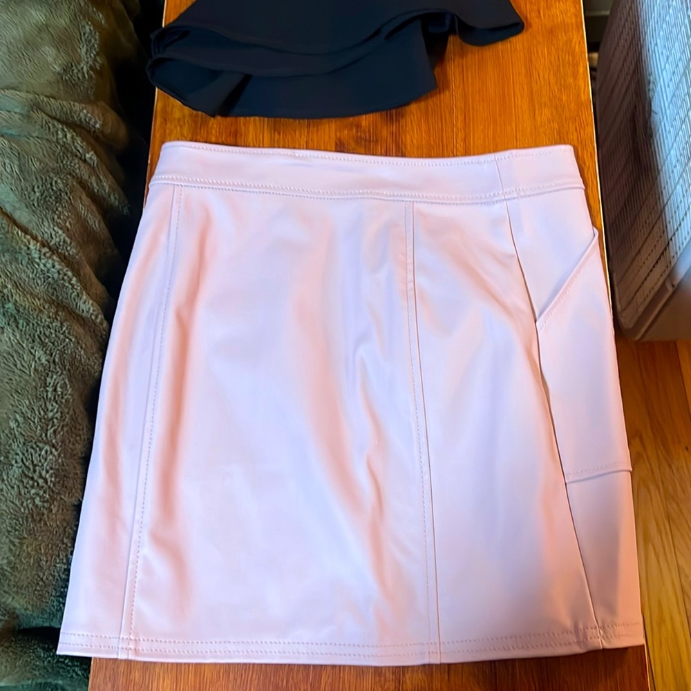 Fun zip up leather skirt.
